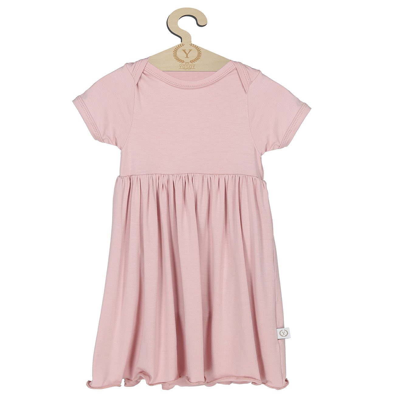 Różowa sukienka niemowlęca z krótkim rękawem na wieszaku.