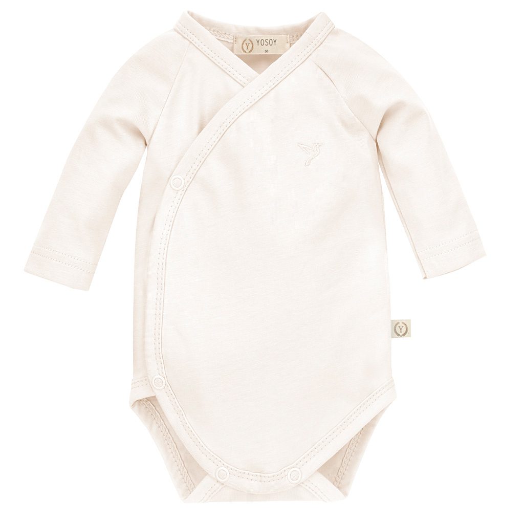 Body niemowlęce z długim rękawem w kolorze kremowym.